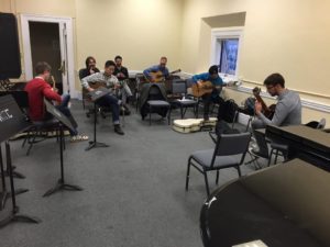 Brad Rau with the other guitar majors at New England Conservatory getting reading for performance class. 